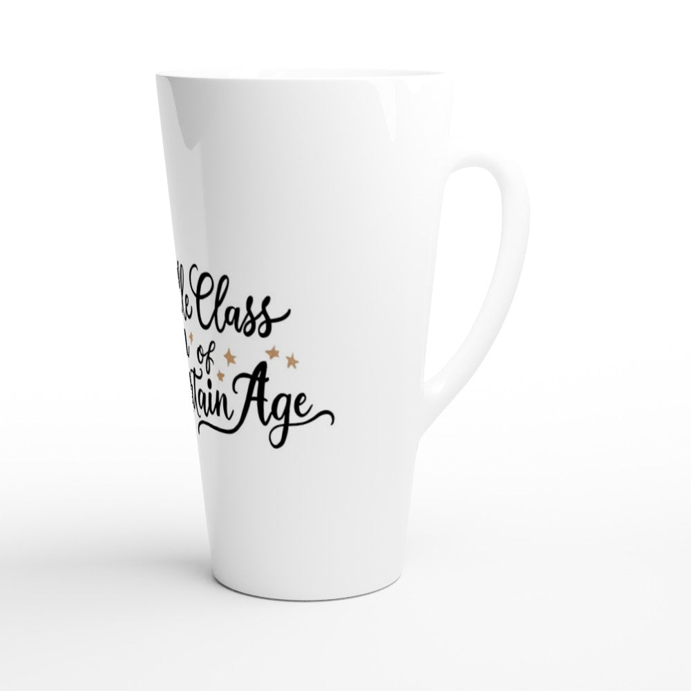 A stylish 17oz white ceramic latte mug with the text ‘middle class woman of a certain age,’ perfect for sipping coffee with a touch of personality.