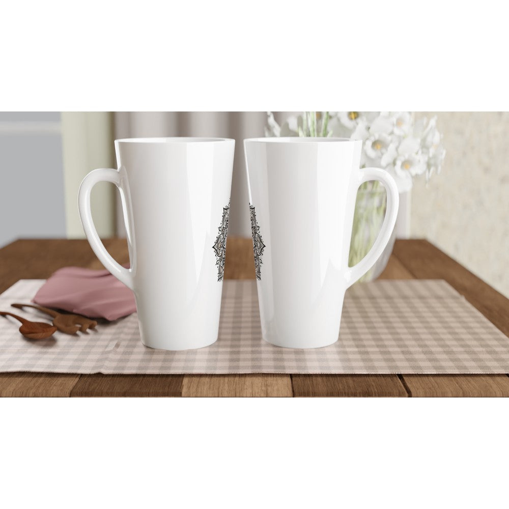 A stylish 17oz white ceramic latte mug featuring an intricate black and white mandala design. 