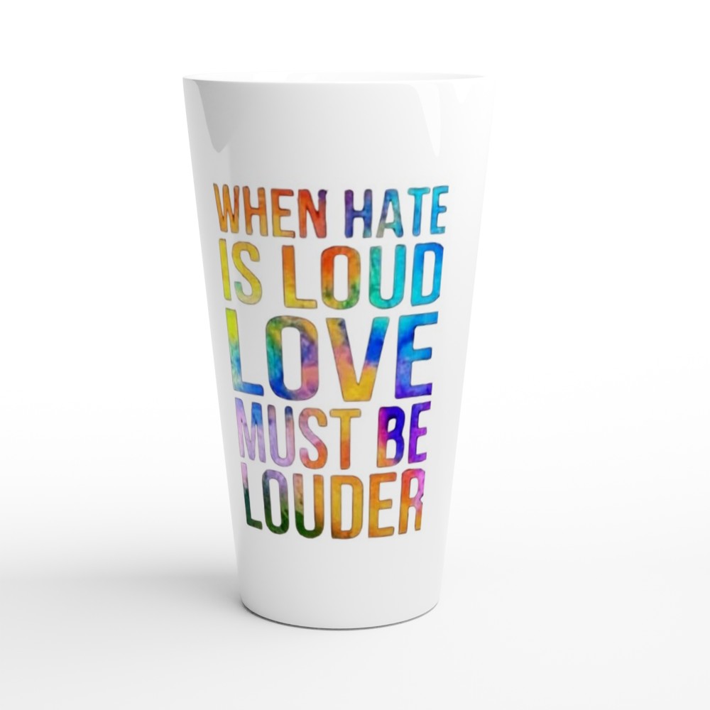 A stylish 17oz white ceramic latte mug featuring the inspiring words ‘Love must be louder’ in rainbow colours.