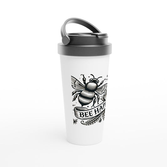 A stylish 15oz stainless steel travel mug featuring a bee and a flower in an old fashioned tattoo style, with the words ‘bee happy.’ White with a black lid and handle. Maintains the temperature of either hot or cold drinks.