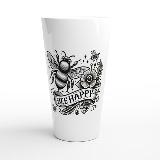 A stylish 17oz white ceramic latte mug featuring a bee and a flower in an old fashioned tattoo style, with the words ‘bee happy.’ 