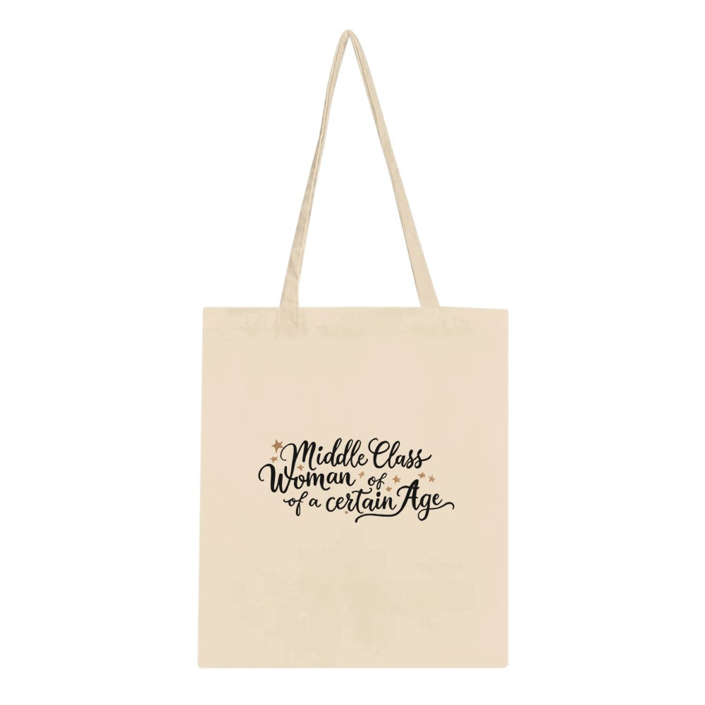 A chic tote bag adorned with the phrase ‘middle class woman of a certain age,’ ideal for stylishly transporting your belongings and showing pride in your life’s experience.