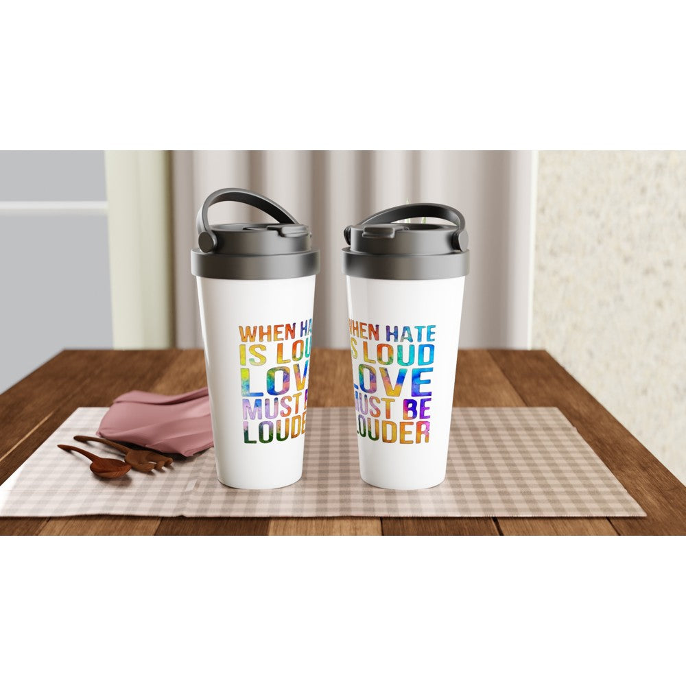 A stylish 15oz stainless steel travel mug featuring the inspiring words ‘Love must be louder’ in rainbow colours. White with a black lid and handle. Maintains the temperature of either hot or cold drinks.
