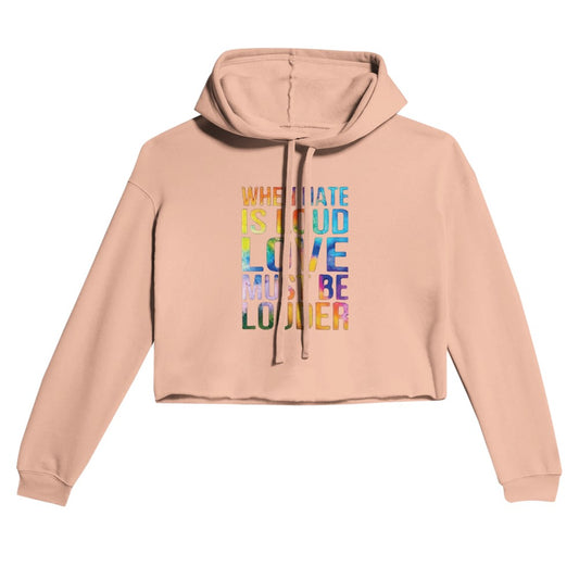 A vibrant women’s cropped hoodie featuring the phrase ‘When hate is loud, love must be louder’ in bold rainbow coloured lettering. Available in a range of colours.